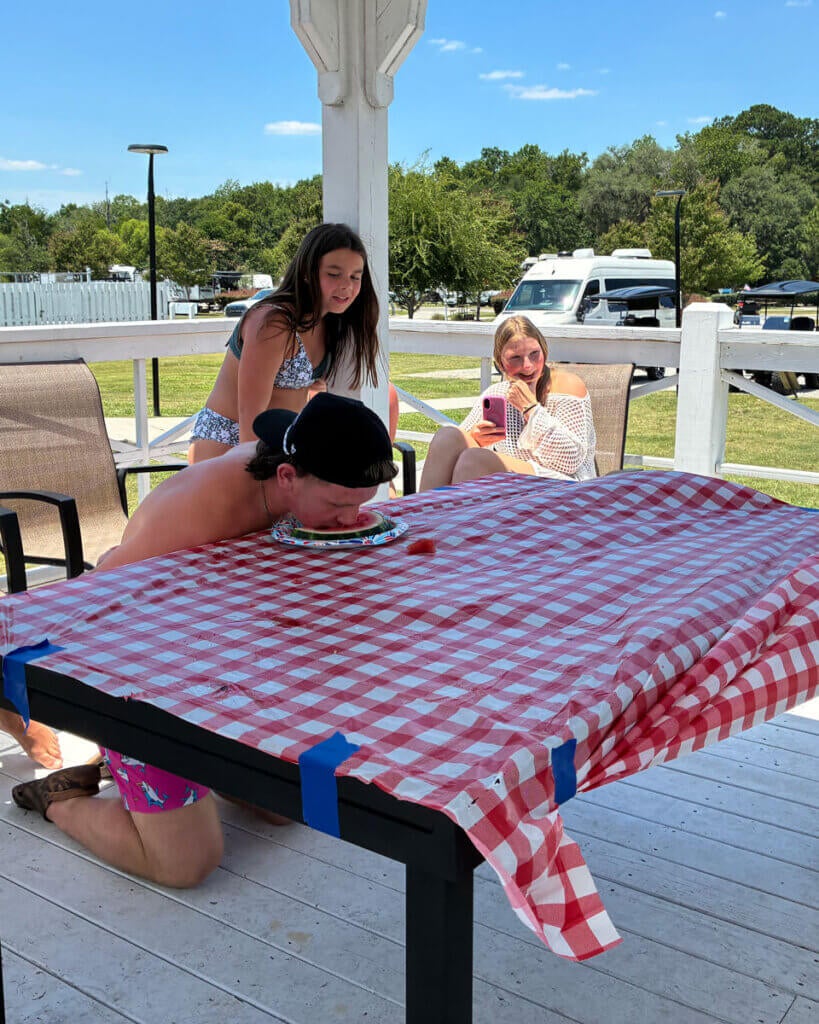 Guests at Creekfire RV Resort in Savannah, Georgia participating in a watermelon eating contest