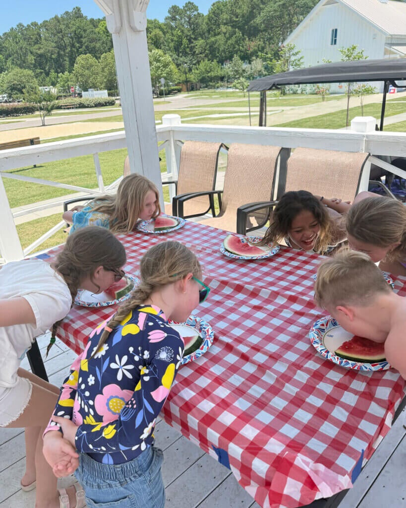 Guests at Creekfire RV Resort in Savannah, Georgia participating in a watermelon eating contest