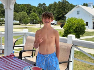 Guests at Creekfire RV Resort in Savannah, Georgia participating in a watermelon eating contest