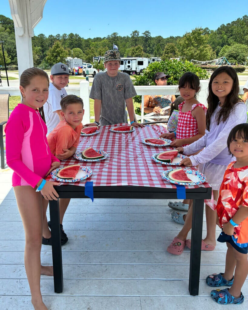 Guests at Creekfire RV Resort in Savannah, Georgia participating in a watermelon eating contest