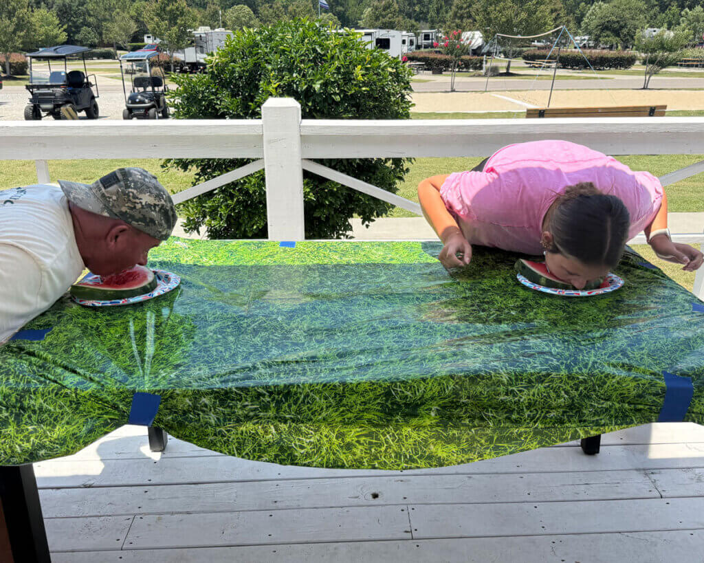 Guests at Creekfire RV Resort in Savannah, Georgia participating in a watermelon eating contest