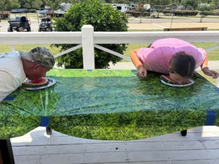 Guests at Creekfire RV Resort in Savannah, Georgia participating in a watermelon eating contest