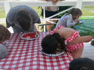 Guests at Creekfire RV Resort in Savannah, Georgia participating in a watermelon eating contest