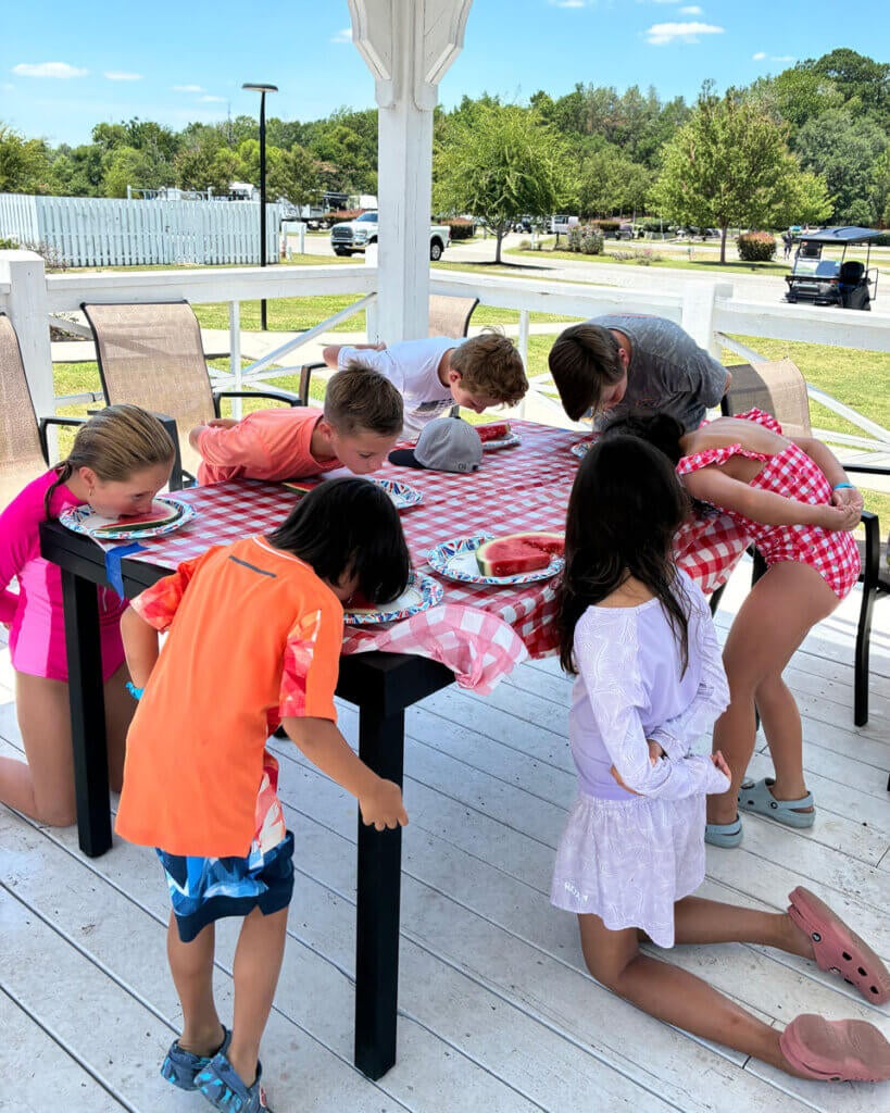 Guests at Creekfire RV Resort in Savannah, Georgia participating in a watermelon eating contest