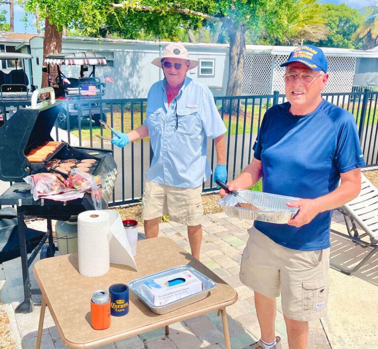 Residents at Meadowlea Village in Deland, Florida cooking out at Memorial Day Cookout event