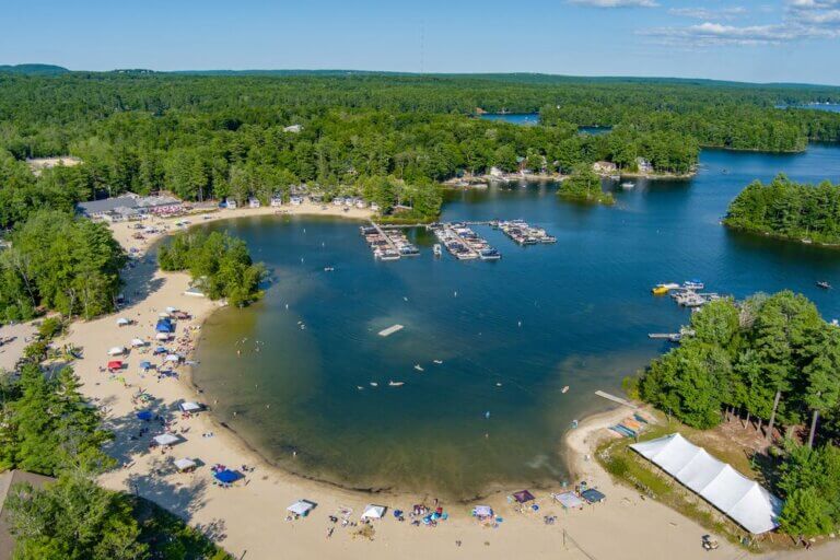 View of the Point Sebago Resort beach and marina in Maine.