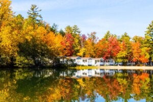 The fall leaves changing colors around the Point Sebago cabins in Maine.