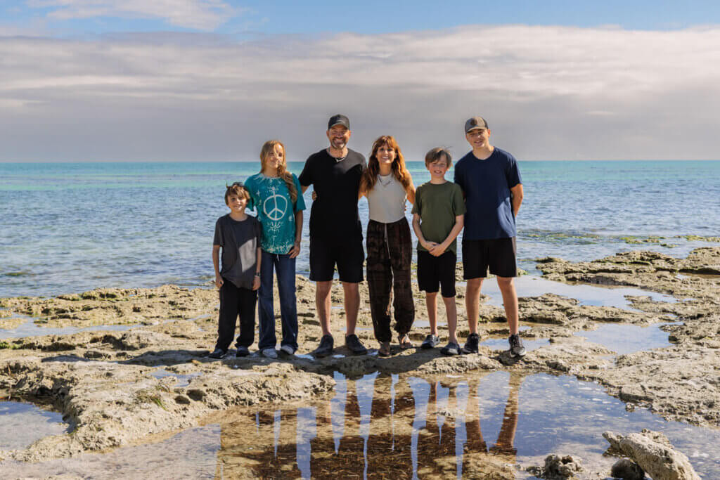 The Hocking family standing by the Atlantic Ocean at Big Pine Key RV Park in Florida.