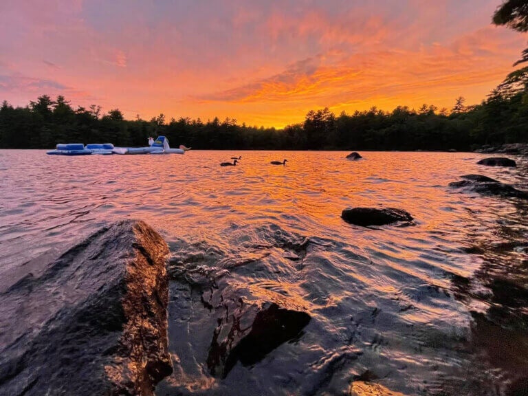 Sun setting on Sebago Lake in Casco, Maine