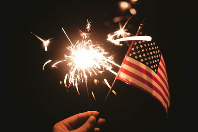 Small American flag and sparkler.