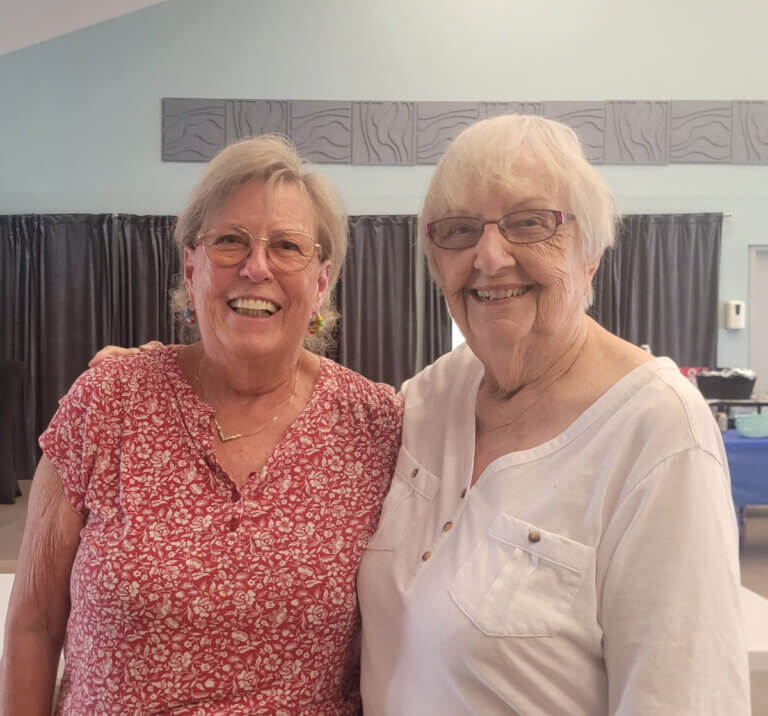 Residents from Camelot Lakes Village in Sarasota, Florida smiling together