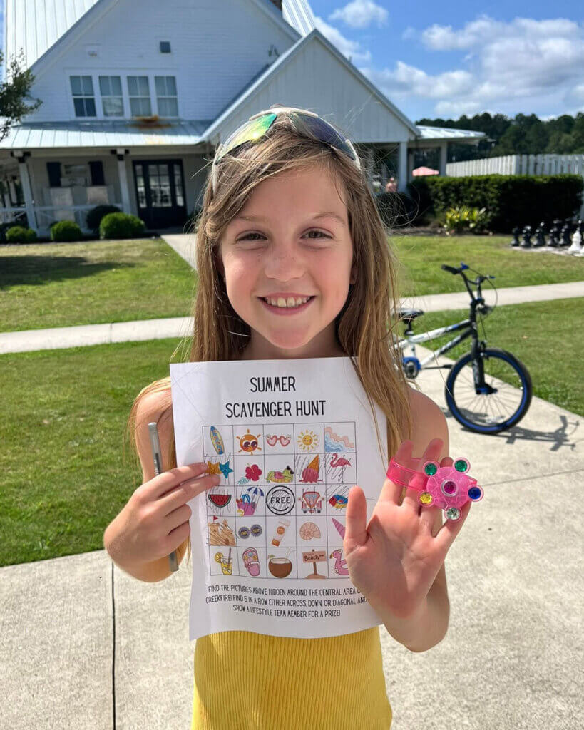 Camper participating in a summer scavenger hunt at Creekfire RV Resort in Savannah, Georgia