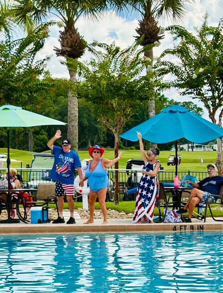 People dancing by the swimming pool at Cypress Lakes Village in Lakeland, Floirda.