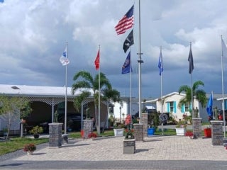 Veterans Club lead a flag raising ceremony for America's 250th at The Meadows in Tarpon Springs, Florida
