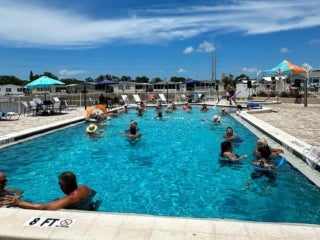 Residents celebrate the 4th of July with a pool party at The Meadows in Tarpon Springs, Florida