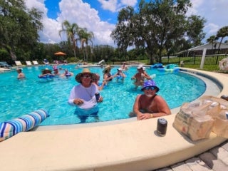 Residents at the pool celebrating Fourth of July at Holiday RV Park in Leesburg, Florida.