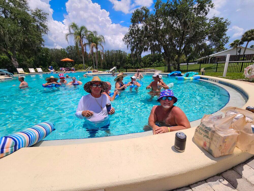 Residents in the pool celebrating Fourth of July at Holiday RV Park in Leesburg, Florida.