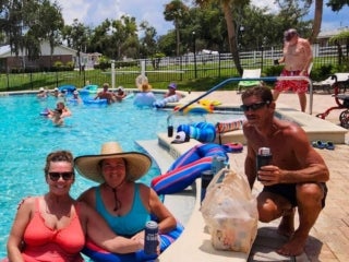 Residents at the pool celebrating Fourth of July at Holiday RV Park in Leesburg, Florida.