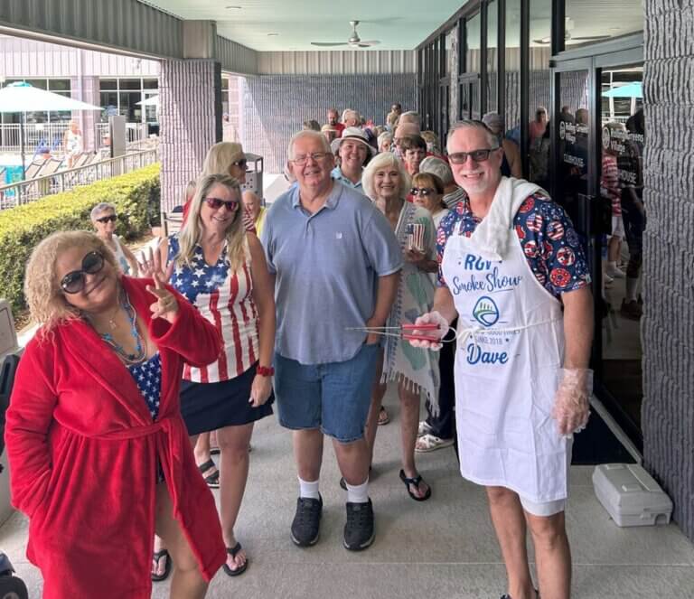 Community Manager with 55+ residents at the 4th of July pool party and barbecue at Rolling Greens Village in Ocala, Florida.