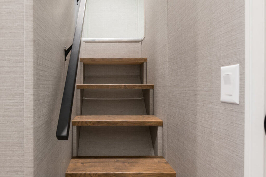 Birch Circle model cabin loft stairs at Point Sebago Resort on Lake Sebago in Maine.