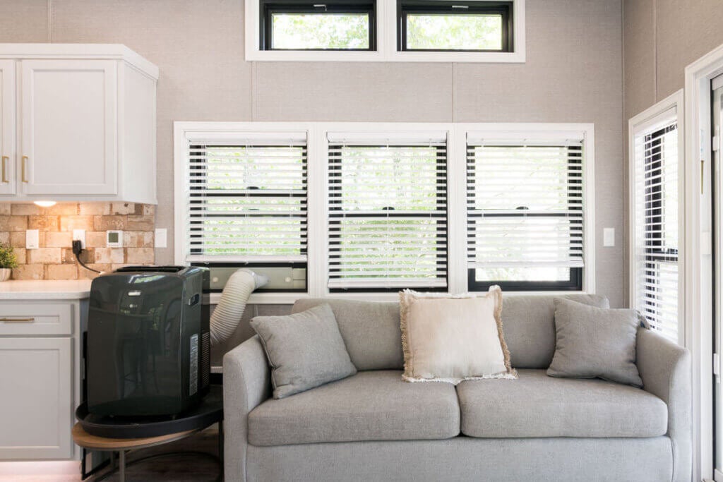 Birch Circle model cabin couch area at Point Sebago Resort on Lake Sebago in Maine.