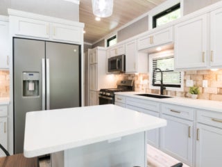 lake-sebago-cabins-birch-circle-16 Birch Circle model cabin kitchen at Point Sebago Resort on Lake Sebago in Maine.