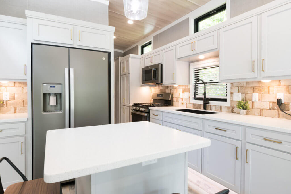 Birch Circle model cabin kitchen at Point Sebago Resort on Lake Sebago in Maine.