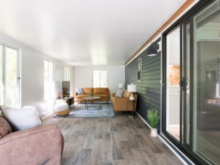lake-sebago-cabins-birch-circle-4 Birch Circle model cabin sunroom at Point Sebago Resort on Lake Sebago in Maine.