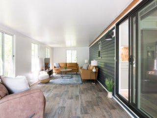 lake-sebago-cabins-birch-circle-4 Birch Circle model cabin sunroom at Point Sebago Resort on Lake Sebago in Maine.