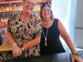 Residents attend a speakeasy murder mystery production in the Marina at Holiday RV Park in Leesburg, Florida.