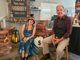 Residents attend a speakeasy murder mystery production in the Marina at Holiday RV Park in Leesburg, Florida.