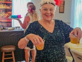 Residents attend a speakeasy murder mystery production in the Marina at Holiday RV Park in Leesburg, Florida.