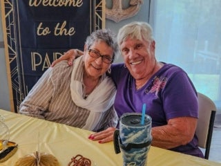 Residents attend a speakeasy murder mystery production in the Marina at Holiday RV Park in Leesburg, Florida.