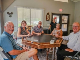Residents attend a speakeasy murder mystery production in the Marina at Holiday RV Park in Leesburg, Florida.