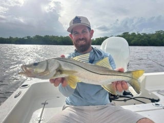 Man holding up fish caught near Chokolosokee RV Park in Florida.
