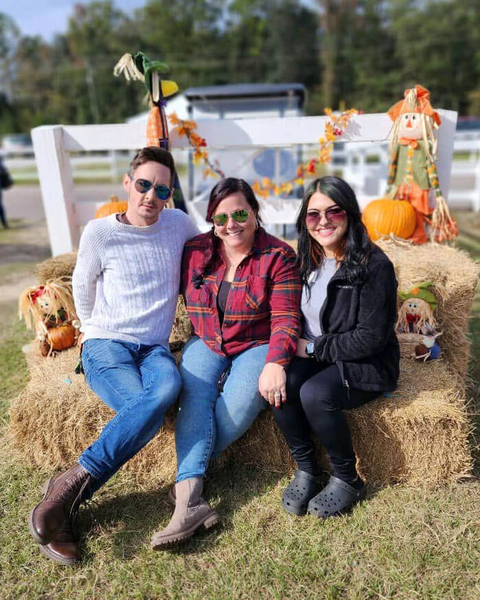 Guests on hay bales at Creekfire RV Resort in Savannah, Georgia