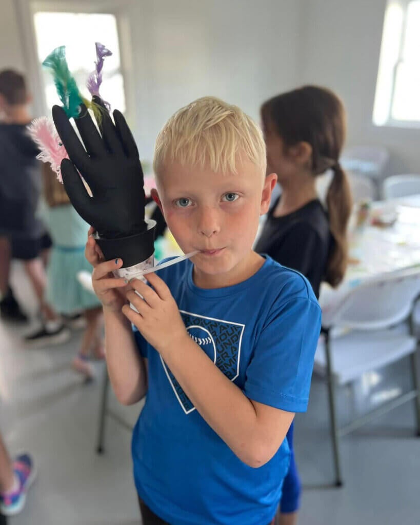 Child showing off their craft at Creekfire RV Resort in Savannah, Georgia