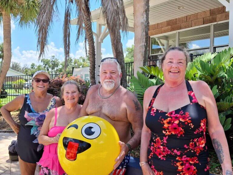 Guests at the outdoor pool at 55+ Holiday RV Park in Leesburg, FL.