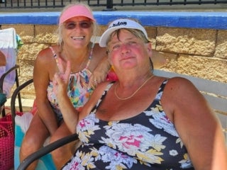 Two ladies at the outdoor pool at 55+ Holiday RV Park in Leesburg, FL.