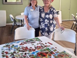 Jigsaw puzzle wars competition for Adult Twisted Summer camp at 55+ Holiday RV Park in Leesburg, FL.
