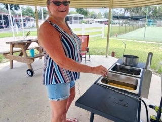 Guest making funnel cakes for a carnival food competition at Holiday RV Park in Leesburg, Florida.