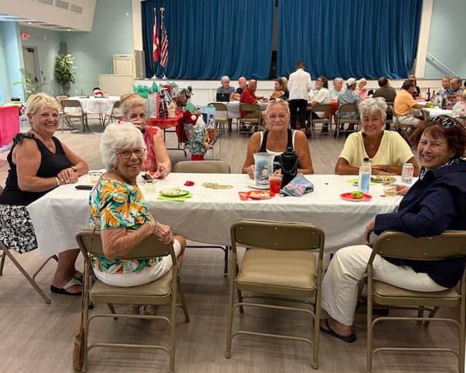 Residents at Camelot Lakes Village in Sarasota, Florida enjoying a Christmas In July event