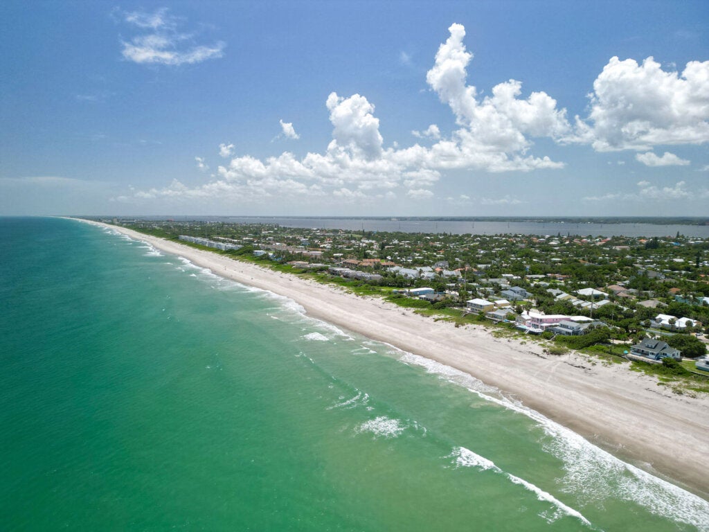Aerial ocean and beach views on a beautiful sunny Summer day in Melbourne Beach, Florida