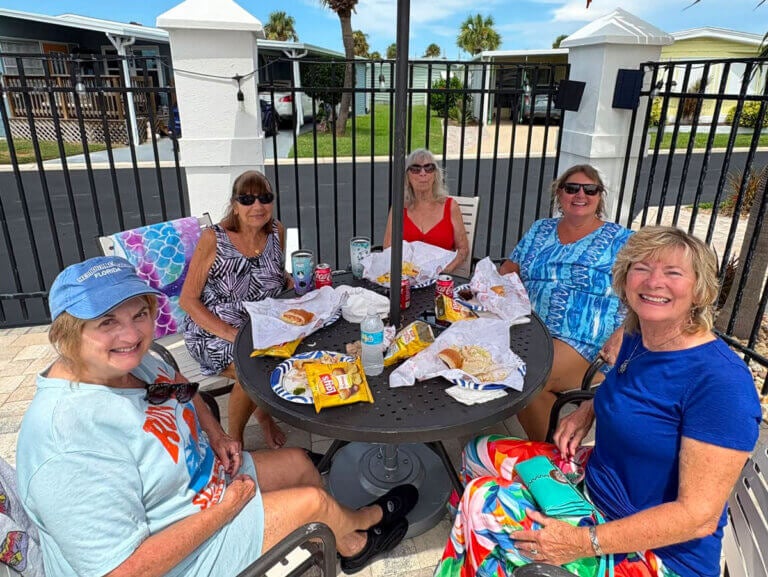 Residents at The Waters in Melbourne Beach, Florida eating food during the pool re-opening.