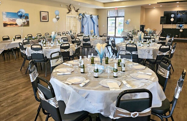 Tables decorated for Missy and Britt’s wedding inside The Meadows clubhouse in Tarpon Springs, Florida.