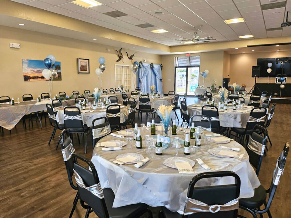 Tables decorated for Missy and Britt’s wedding inside The Meadows clubhouse in Tarpon Springs, Florida.