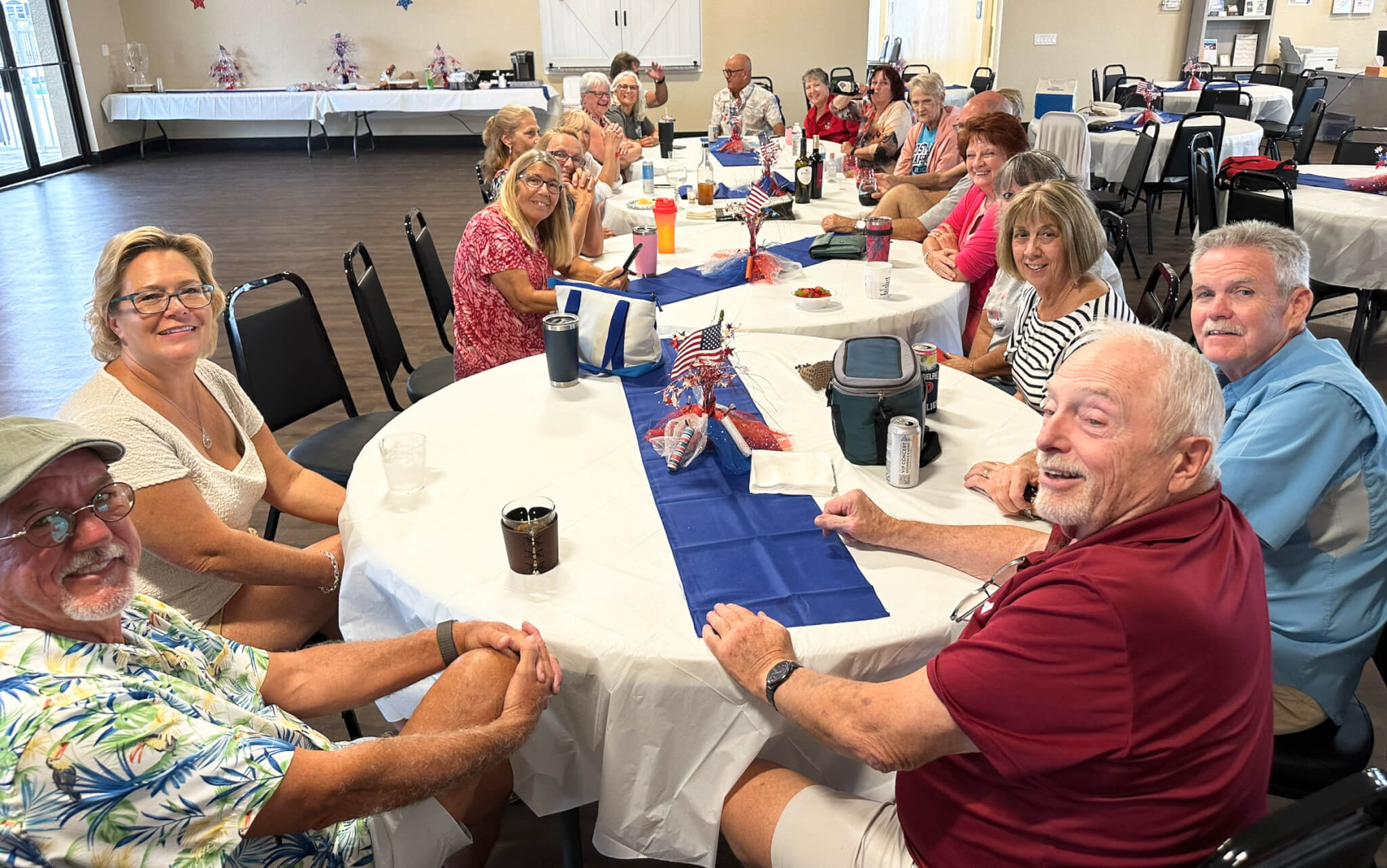 Residents gather in the community clubhouse for Wine Down Wednesday at The Meadows in Tarpon Springs, FL.