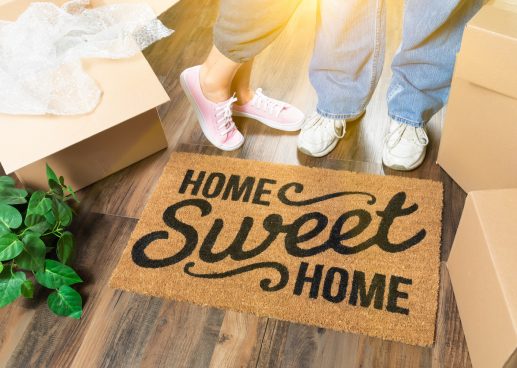 Couple with welcome mat