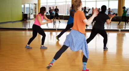 People dance for fitness purposes with Zumba class