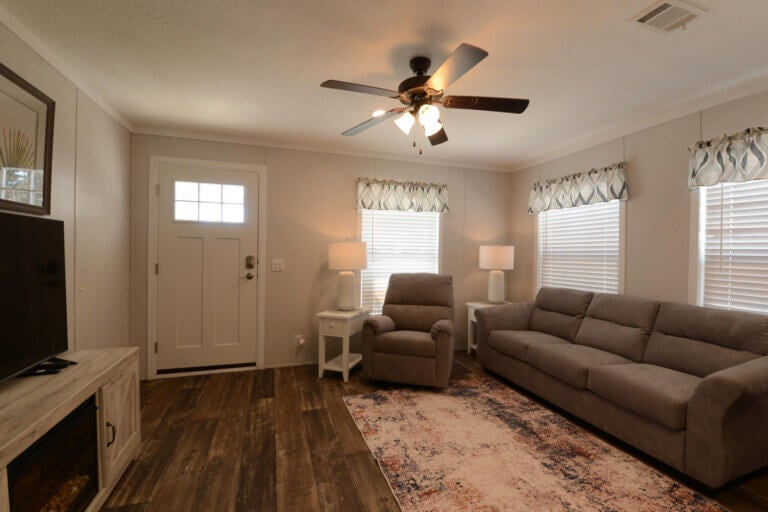 Living room with a couch inside a manufactured home at the address 6604 A Lakewood Dr